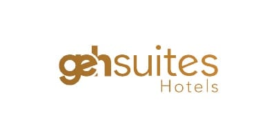 Gei Suites Hotels logo in gold text on white background